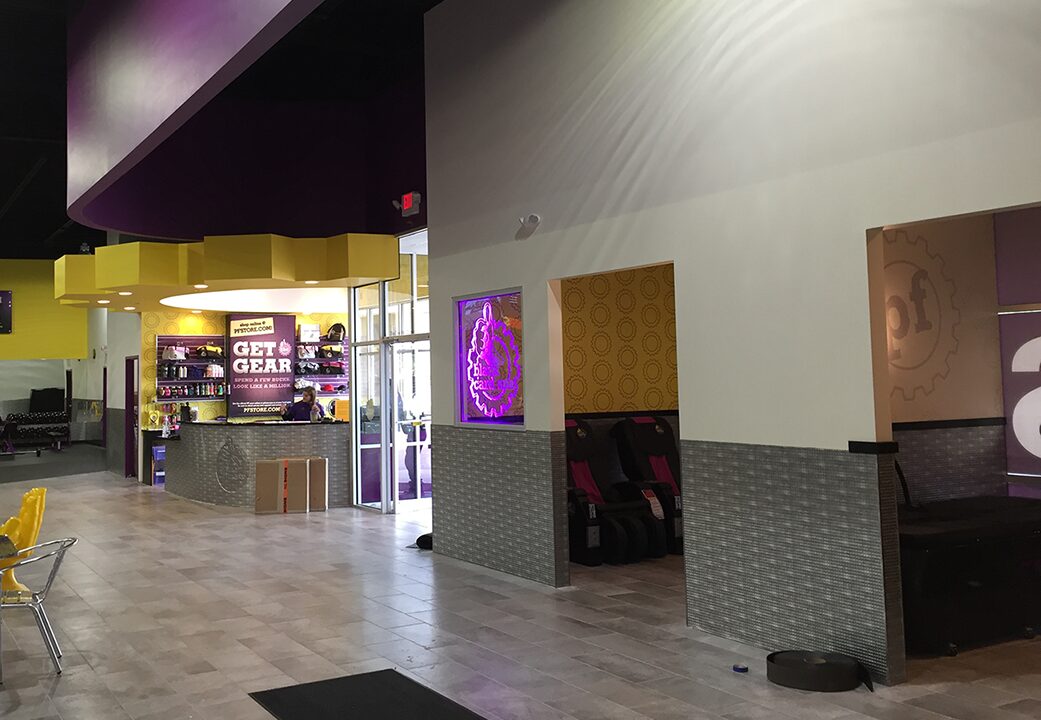 Finished commercial fitness buildout with curved feature soffits and painted walls, drywall by Wade's Drywall, Sioux Falls