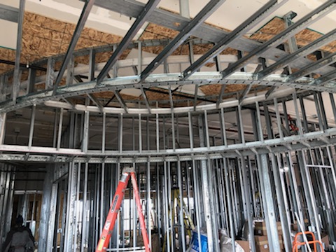 Curved steel-stud soffit, drywall and framing work by Wade's Drywall, Sioux Falls, 2021