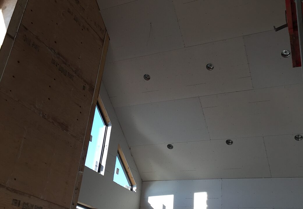 Vaulted ceiling hung, screwed off, ready for tape, work in progress by Wade's Drywall, Sioux Falls